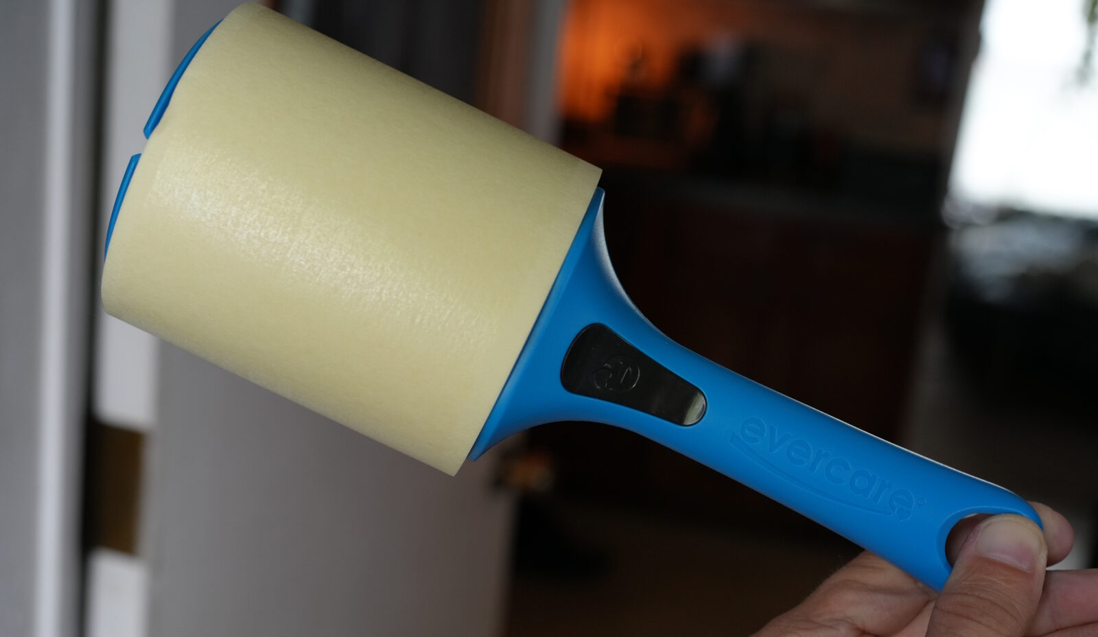 Evercare lint roller with adhesive sheets, blue handle, ready to peel